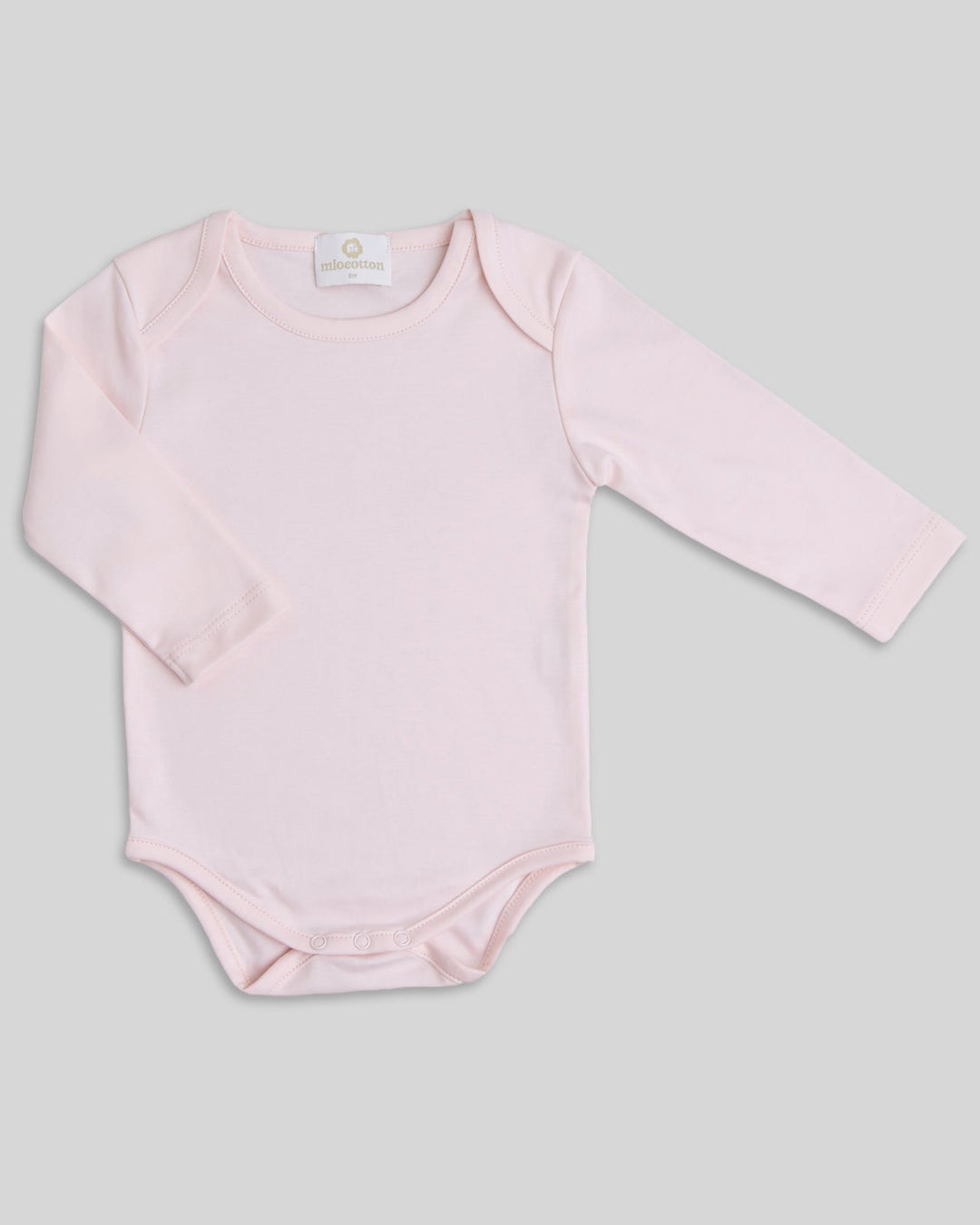 Body para bebés en color rosado, práctico y elegante.