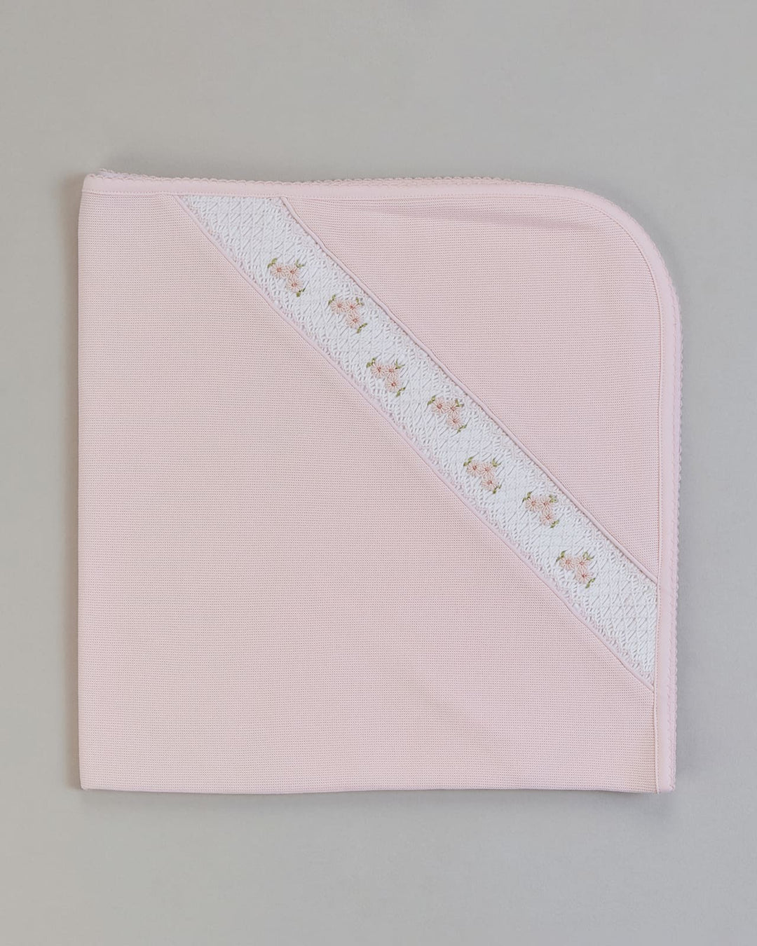 Manta Zuzzel para niña color rosado con bordado punto smock
