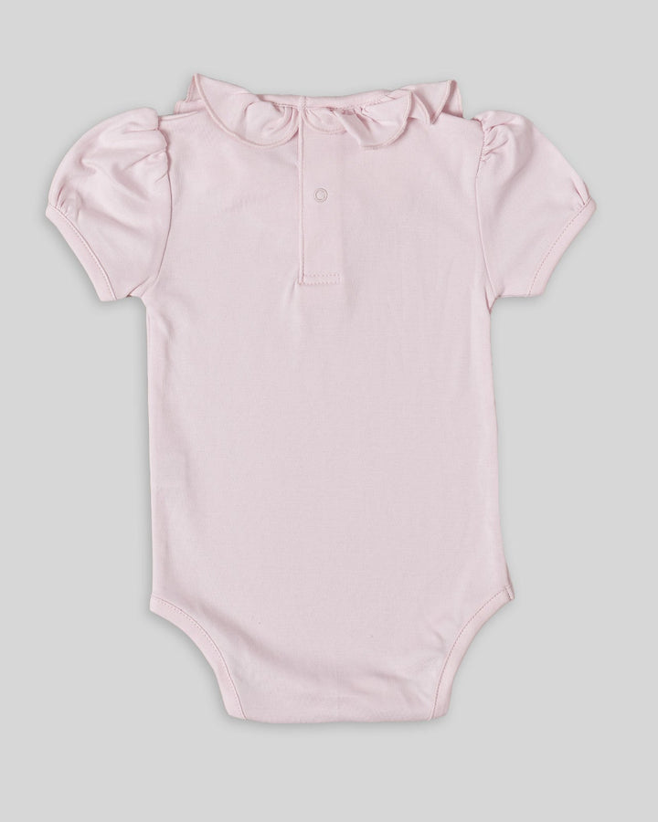 Body con cuello para bebés en color rosado, práctico y elegante.