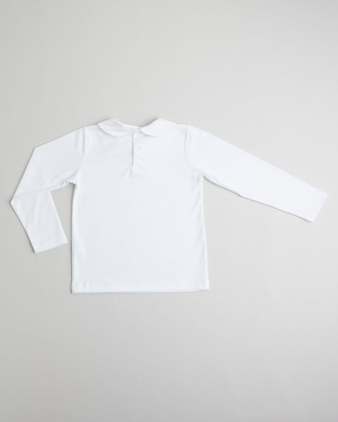 Polo blanco con picoeta Blanco para niñas, comodo y con un diseño clasico ideal para el dia a dia.