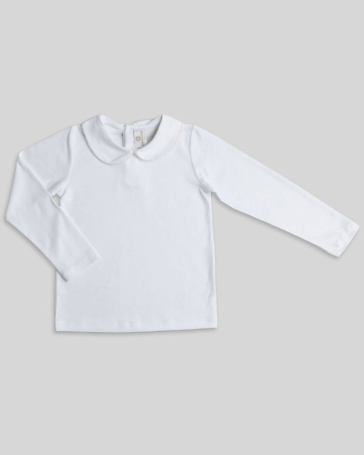 Polo blanco con picoeta rosada para niñas, detalle sutil y encantador para un estilo tierno.