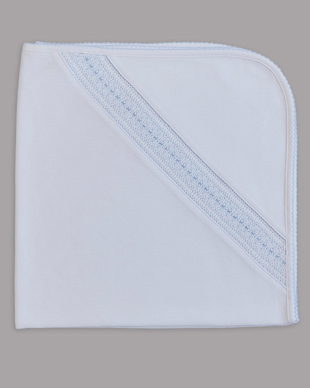 Manta Renzi para niño color blanco con bordado punto smock