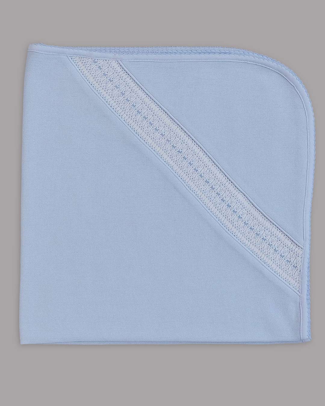 Manta Renzi para niño color celeste con bordado punto smock