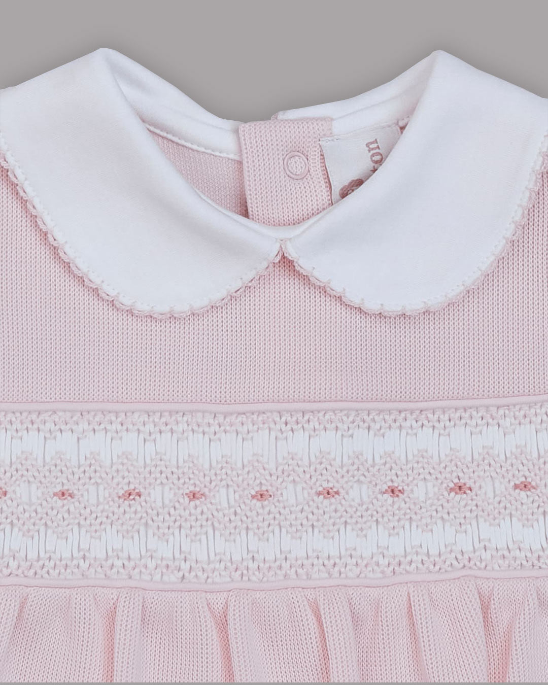 Enterizo corto Dina para bebes en color rosado con bordado punto smock 